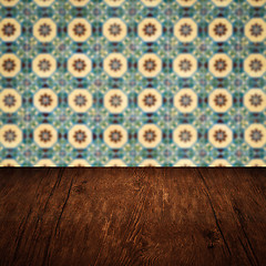 Image showing Wood table top and blur vintage ceramic tile pattern wall