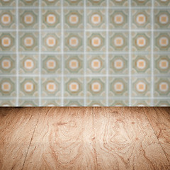 Image showing Wood table top and blur vintage ceramic tile pattern wall