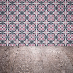 Image showing Wood table top and blur vintage ceramic tile pattern wall