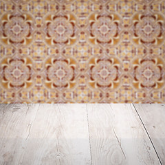 Image showing Wood table top and blur vintage ceramic tile pattern wall