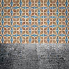 Image showing Wood table top and blur vintage ceramic tile pattern wall