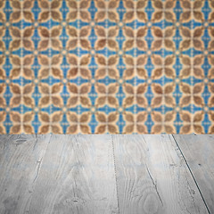 Image showing Wood table top and blur vintage ceramic tile pattern wall