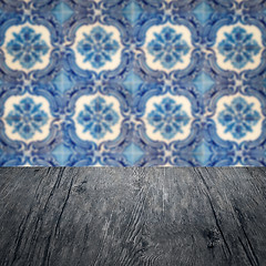 Image showing Wood table top and blur vintage ceramic tile pattern wall