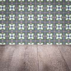 Image showing Wood table top and blur vintage ceramic tile pattern wall