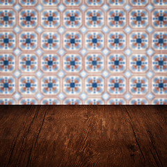 Image showing Wood table top and blur vintage ceramic tile pattern wall