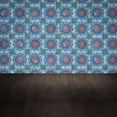 Image showing Wood table top and blur vintage ceramic tile pattern wall