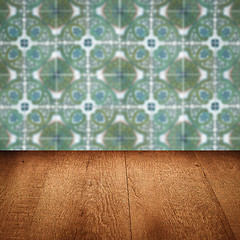 Image showing Wood table top and blur vintage ceramic tile pattern wall