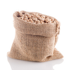 Image showing Uncooked chickpeas on burlap bag