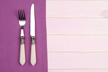 Image showing Kitchenware on purple towel