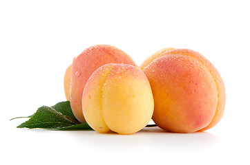 Image showing Sweet peaches with leafs