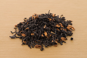 Image showing Black dry tea with petals