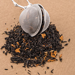 Image showing Black dry tea with petals