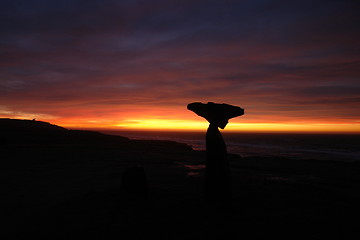 Image showing Sunset near beach with stonesculpture