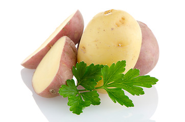 Image showing New potatoes and green parsley