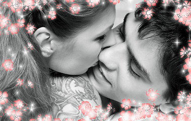 Image showing monochrome picture of sweet couple in bed with flowers