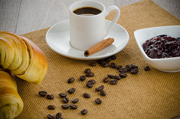 Image showing Cup of black coffee and croissant 