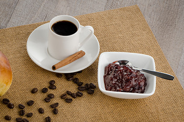 Image showing Cup of black coffee and croissant 