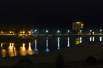 Image showing Cityscape on riverside at night