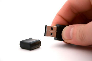 Image showing usb storage in hand on a white background. isolated