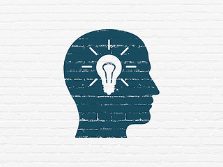 Image showing Advertising concept: Head With Light Bulb on wall background