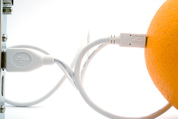 Image showing The orange connected through usb cable