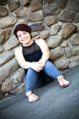 Image showing Smiling Brunette Woman Sitting