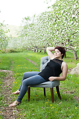 Image showing Woman Sitting in a Vintage Chair