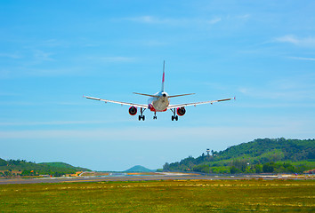 Image showing Twin-engine, modern, commercial airliner coming for a landing at