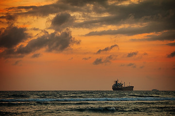 Image showing Enormous Tanker Ship on the Horizon at Sunset