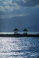 Image showing Tourists Resting in the Shelter of a Oceanside Pagoda