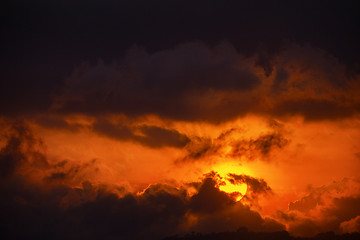 Image showing Sun\'s Last Orange Rays through the Clouds at Dusk