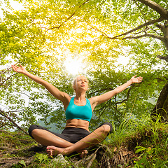 Image showing Woman relaxing in beautiful nature.