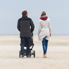 Image showing Young couple walking on the beach