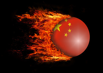 Image showing Flag with a trail of fire - China