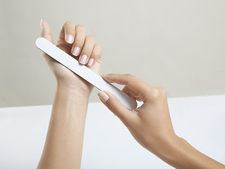 Image showing Woman hands with nail file