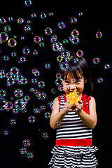 Image showing Asian Chinese Little Girl Playing Soap Bubbles