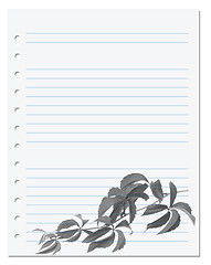 Image showing Exercise book with autumnal virginia creeper twig