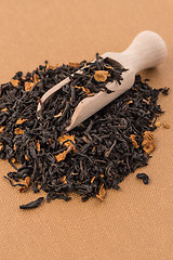 Image showing Black Dry Tea with a Wooden Spoon