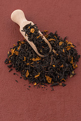 Image showing Black Dry Tea with a Wooden Spoon