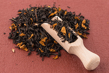 Image showing Black Dry Tea with a Wooden Spoon