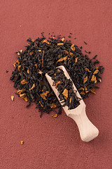 Image showing Black Dry Tea with a Wooden Spoon