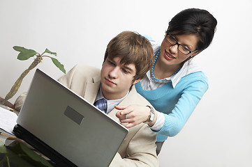 Image showing beautiful caucasian business woman with young consultant