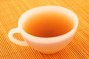 Image showing Cup of tea in warm golden light