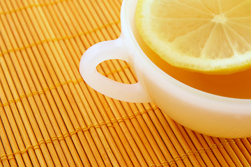 Image showing Teatime. Cup of tea with lemon