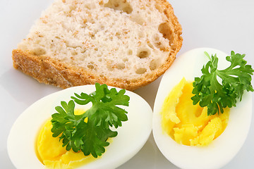 Image showing Cooked eggs decorated with parsley