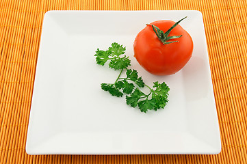 Image showing Tomato and parsley on a square plate