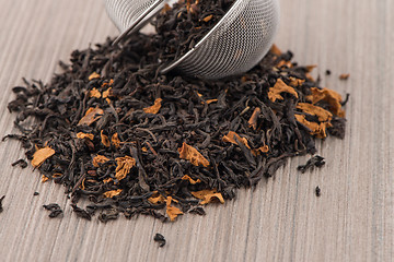 Image showing Black dry tea with petals