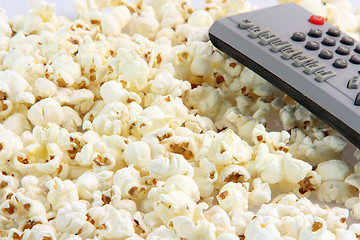 Image showing popcorn and remote control detail