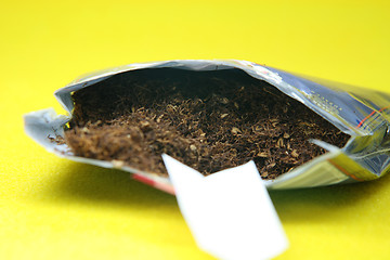 Image showing handrolling tobacco