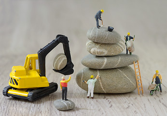 Image showing Pebbles stack and figurines workers